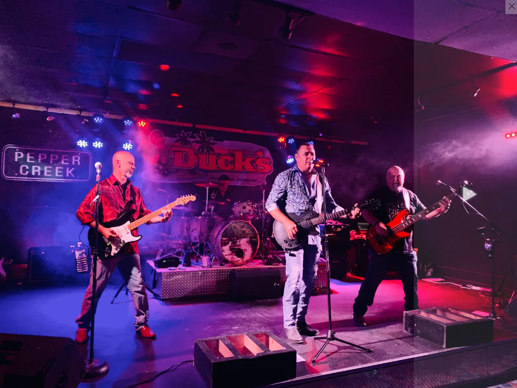 Pepper Creek band plays in a dark room at Duck's in Myrtle Beach